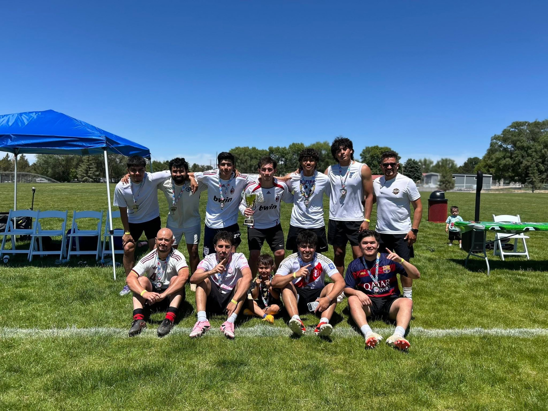Copa Tricolor players celebrating together on the field